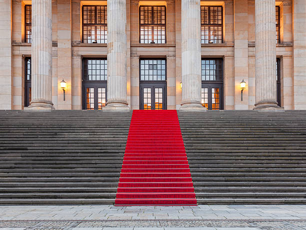 Berlin - red carpet leading to illuminated concert hall stock photo