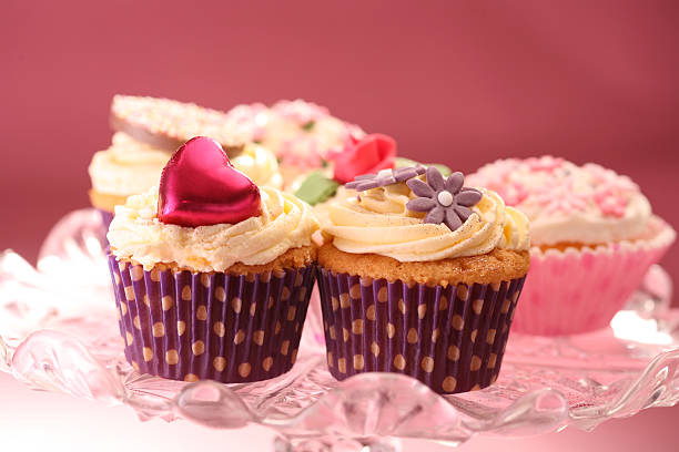 istock Selection of cup cakes on glass plate 464980379