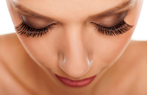 istock Close up of eyes with long artificial eyelashes 464983918