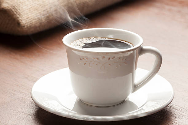 istock beautiful cup of coffee with natural smoke 464984176