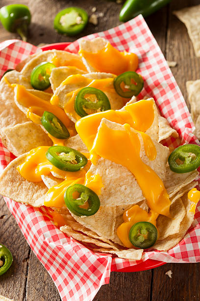 istock Homemade Nachos with Cheddar Cheese 464989974