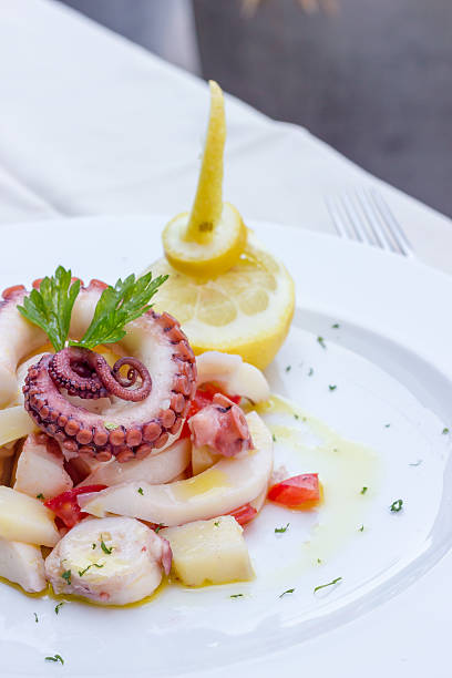 istock Appetizer of cuttlefish octopus and potatoes 464990068