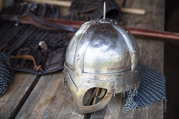istock Replika of Vikings helmet on wooden table 464990404