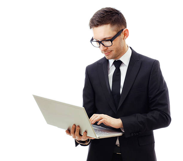 istock Business man holding a laptop and smiling. 464991819