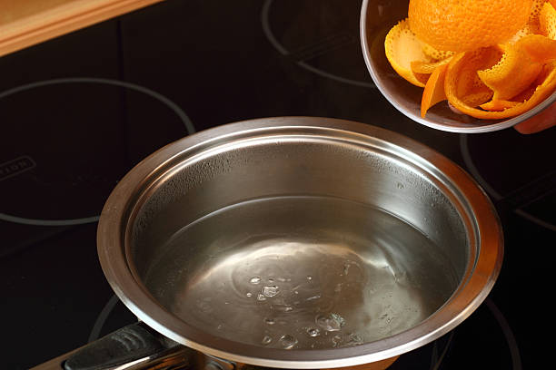 istock Add orange peel into saucepan with boiling syrup 464992559