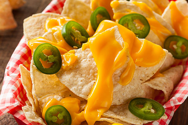 istock Homemade Nachos with Cheddar Cheese 464996080