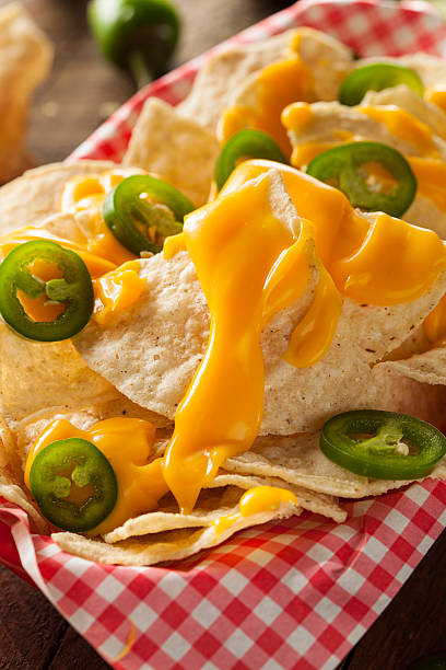 istock Homemade Nachos with Cheddar Cheese 464996088