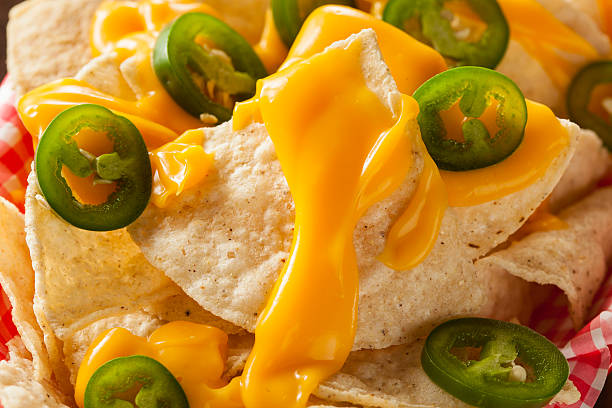 istock Homemade Nachos with Cheddar Cheese 464996090