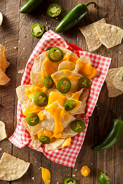 istock Homemade Nachos with Cheddar Cheese 464996094