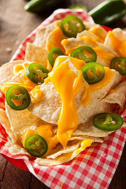 istock Homemade Nachos with Cheddar Cheese 464996098