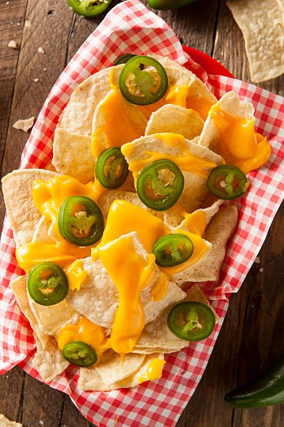 istock Homemade Nachos with Cheddar Cheese 464996100