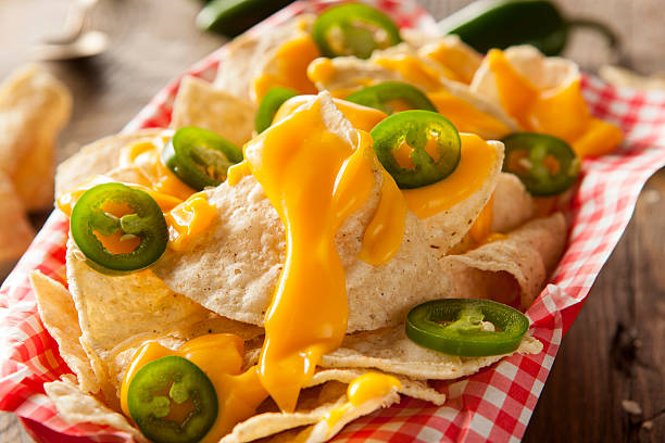 istock Homemade Nachos with Cheddar Cheese 464996102