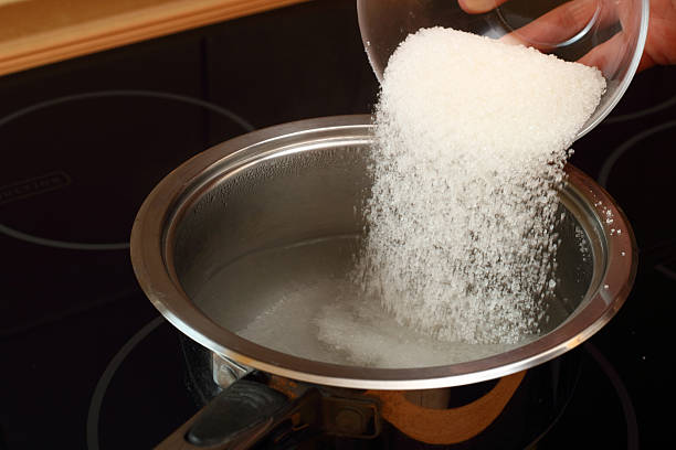 https://media.istockphoto.com/id/464996431/photo/pouring-sugar-into-saucepan-with-boiling-water.jpg?s=612x612&w=0&k=20&c=dK29uLJuFFIOP-oVaxdTVmEd9qBGfi7uj10Mkese444=