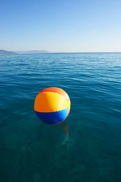bright multicolored beach ball on the beach