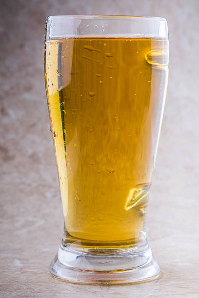 istock full glass of beer on stone background 465000002