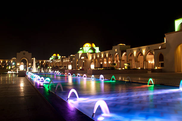 istock Dancing Multi Colored fountain at dark night 465004279