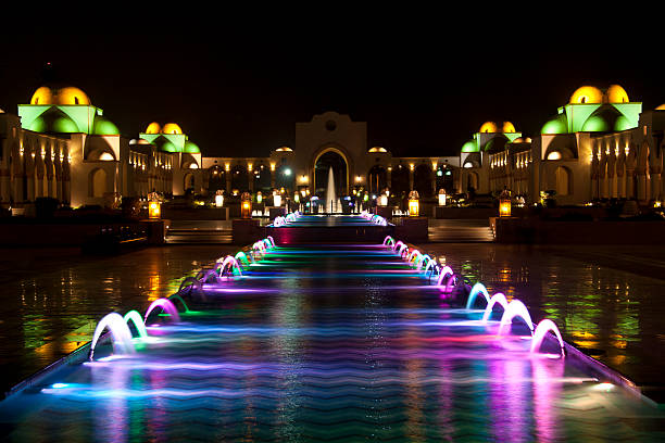 Multi colored fountain design in the dark Dancing Multi Colored fountain at dark night bishkek stock pictures, royalty-free photos & images