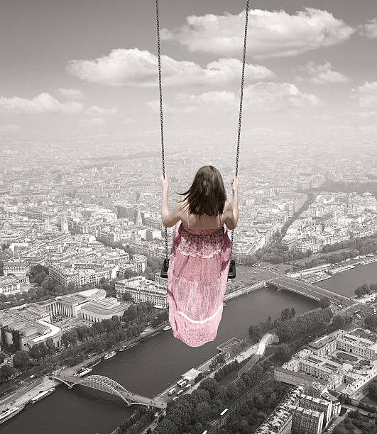 Young woman with a swing on the Paris town backround.