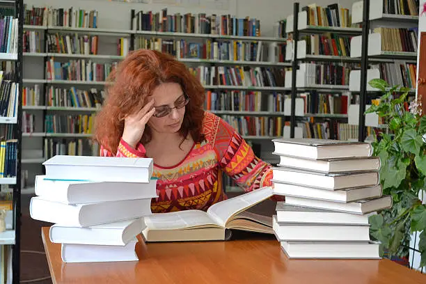 Woman in library reading