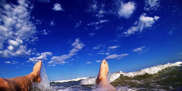 istock Feet relaxaing in ocean. 465006934