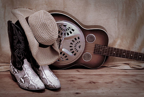 istock snakeskin cowboy boot with a cowboy hat and a dobro 465010564