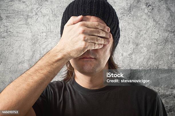 Casual Man With Black Cap Covering Face Stock Photo - Download Image Now - Adult, Adults Only, Black Color