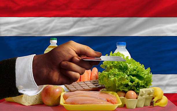 buying groceries with credit card in thailand stock photo