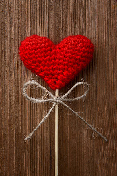 istock red heart on wooden background 465014961