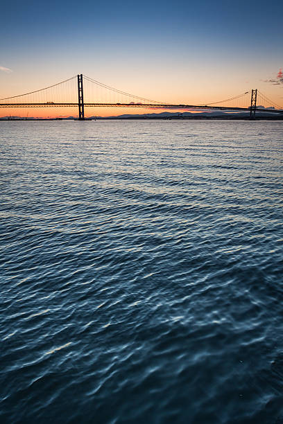 istock Sunset over river and bridges in Queensferry 465016873