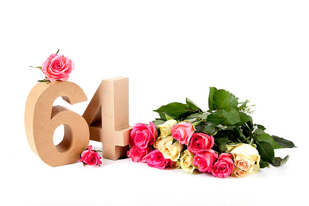 Age in numbers on a bed of roses stock photo