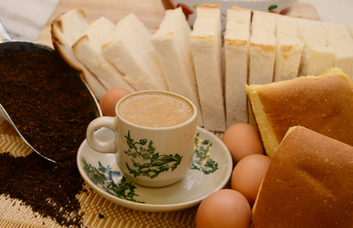 Coffee and bread invented by the Hainan Chinese who migrated to  the present-day Malaysia and Singapore in late 1880s and early 1900s. Most found employments as cooks for the Europeans, hence trained to cook western food but with a twist. 
