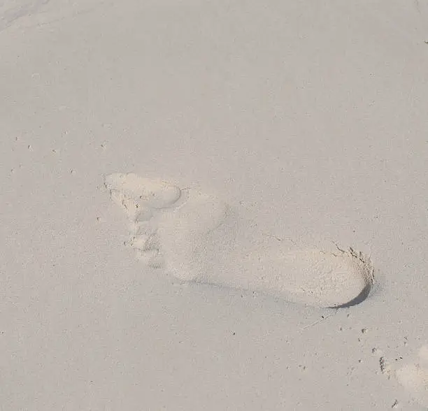 Human Footprints on the White Sand Beach in Tachai island.