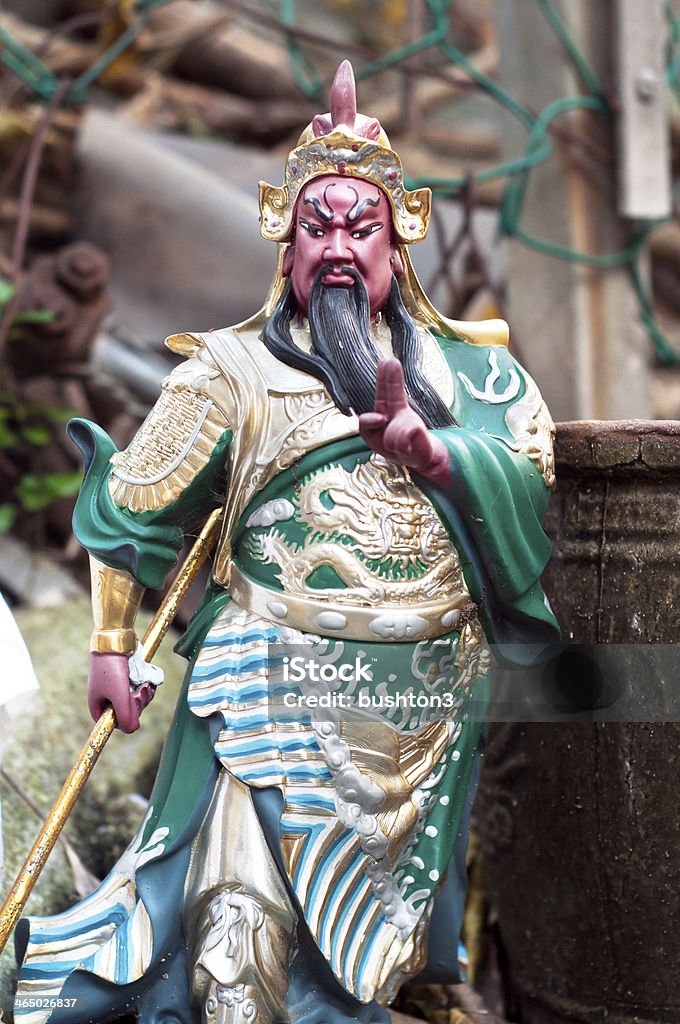Statue of famous Asian deity Guan Yu, Hong Kong HONG KONG - Guan Yu (also known as Guan Gong) is a Chinese god worshiped throughout Southern China, Hong Kong and Taiwan. His statue and image can be found across in temples, shops and restaurants. Guan Yu Stock Photo