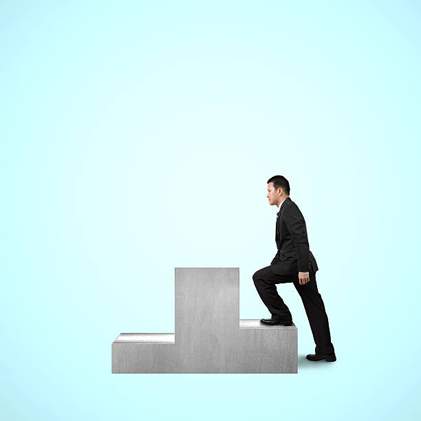 istock Businessman climbing on podium 465026979