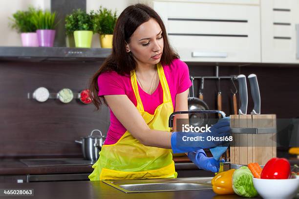 Young Woman Cleaning Kitchen Stock Photo - Download Image Now - Adult, Adults Only, Cheerful