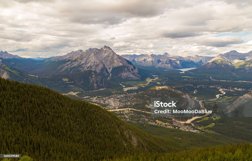 Banff National Park and Banff Town A shot of the beautiful Banff National Park and, visible down below, you can see the Banff town as well as the famous Banff Springs Hotel. 2015 Stock Photo