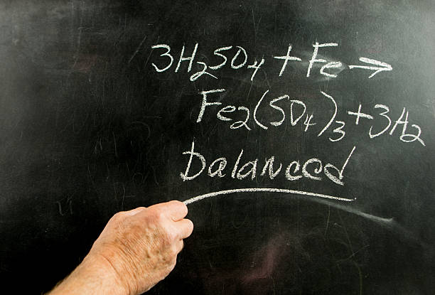 istock Science teacher showing an equation on a blackboard. 465029824