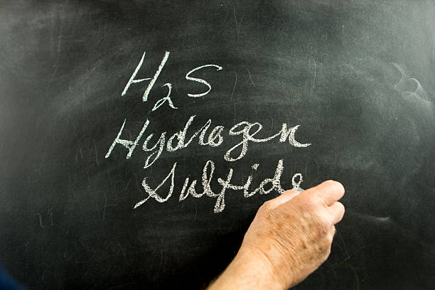 istock Science teacher showing an equation on a blackboard. 465029834
