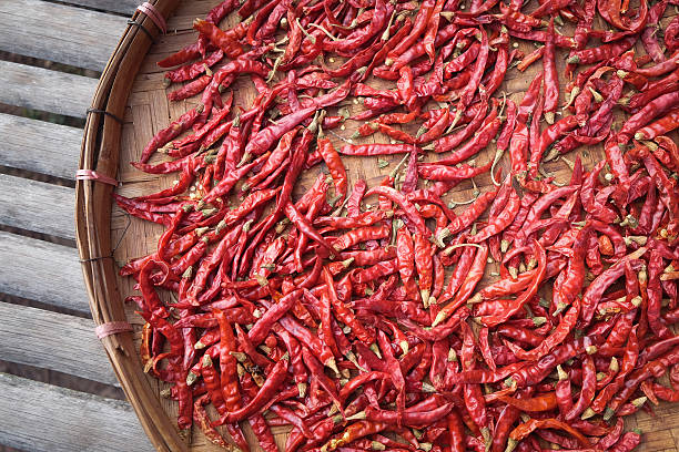 istock Dried red peppers in basket out door 465029902