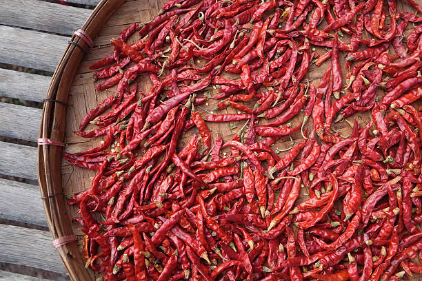 istock Dried red peppers in basket out door 465029912