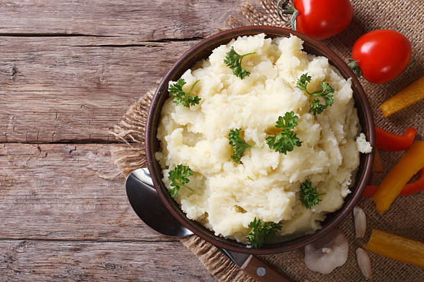 istock mashed potatoes with parsley closeup. horizontal top view 465030424
