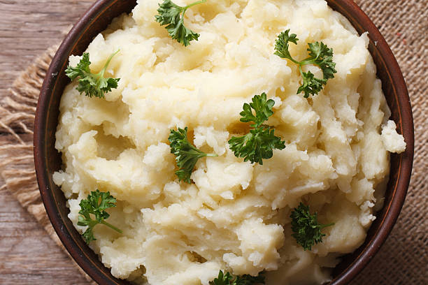 istock mashed potatoes with parsley in a bowl macro top view 465031350