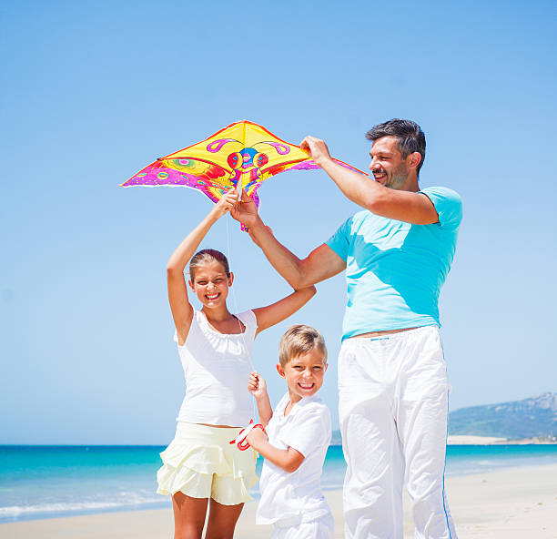 istock Boy and his father with kite 465031932