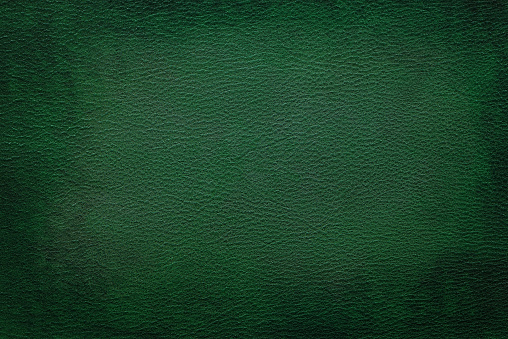 Old vintage green leather texture closeup can be used as background