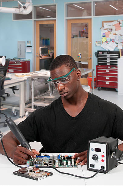 Man soldering stock photo