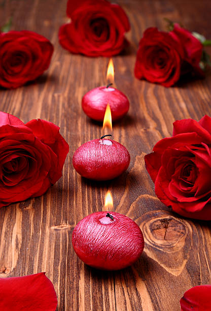 istock Romantic composition with red candles and roses. selective focus 465033095