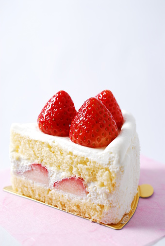 The cake which three strawberries appeared in.