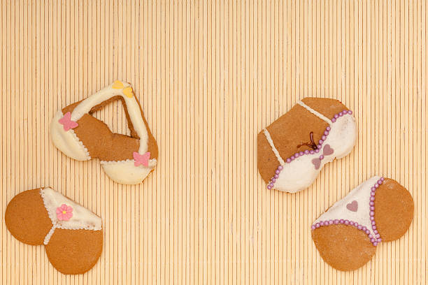 istock Funny colorful bikini shape gingerbread cakes cookies on bamboo mat 465033733