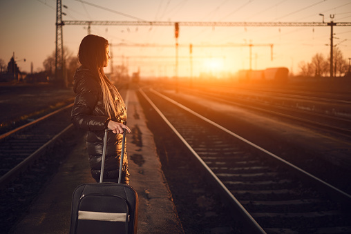 Young traveler woman in railway