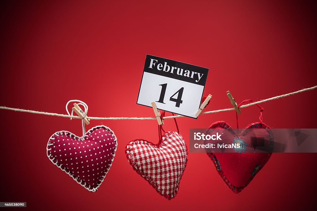 February 14, Valentine's day, red heart February 14, on the calendar, Valentine's day, red heart, red background 2015 Stock Photo